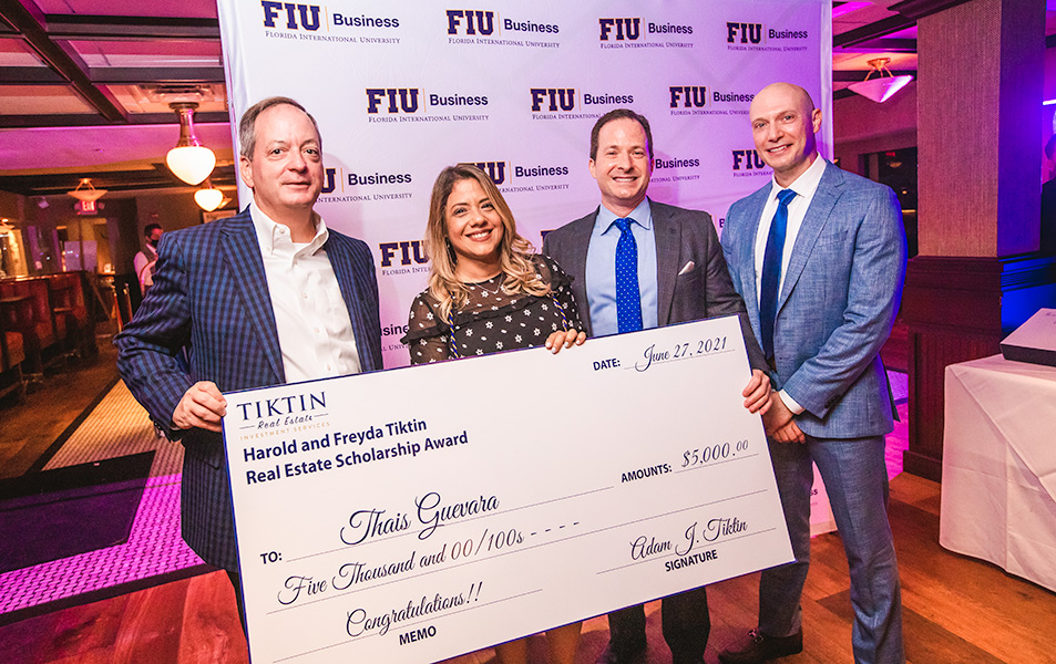 FIU Business student accepting a scholarship