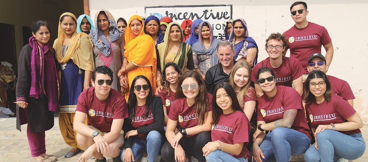 IBHS students and village women in front of the Bandwhari Women's Center