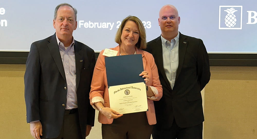 (L to R) William Hardin, dean, FIU Business; Shelly Gonzales, assistant vice president, nursing, Boca Raton Regional Hospital; and Attila Hertelendy, assistant professor of information systems and business analytics, FIU Business, at the closing of the Baptist Health Leadership Experience Program on February 24, 2023 at FIU Business.