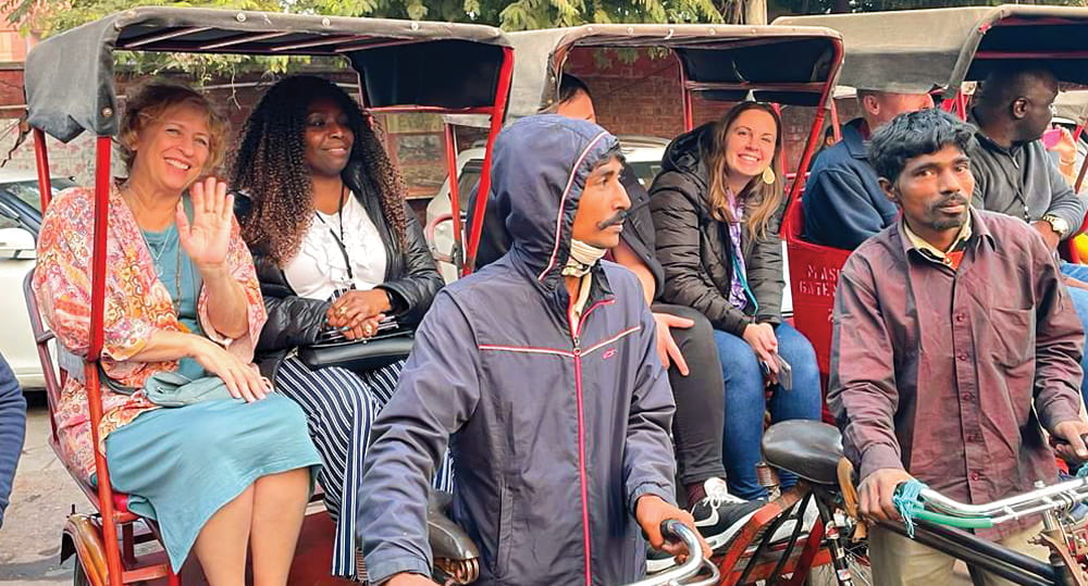 (L to R) Wendy Guess, associate teaching professor of marketing and logistics, FIU Business, and Venita Ross, program manager, Mill Center at Salt Lake Community College, share a rickshaw ride during the FIU Center for International Business Education and Research (CIBER) Faculty Development in International Business program in India December 28, 2022 to January 8, 2023.