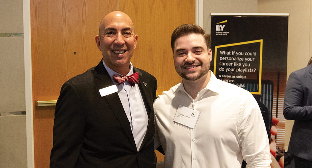 (L to R) Jimmy Carmenate, clinical assistant professor of accounting, FIU Business, and Luigi Estevanel (BAcc ’03), staff consultant, EY, at the Ahead of the Game Accounting & Business Expo career fair on February 15, 2023.