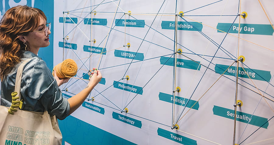 Participant Vanessa Rey Perillo connects with an interactive art installation.