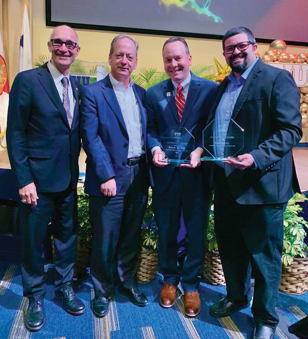 (L to R) Kenneth Jessell, president, FIU; William Hardin, dean, FIU Business; Brian Van Hook, regional director, Florida SBDC at FIU Business (FSBDC); and Jesus Padilla (MSM '17, MBA '11), assistant director, FSBDC, at a Small Business Week celebration on May 2, 2024.