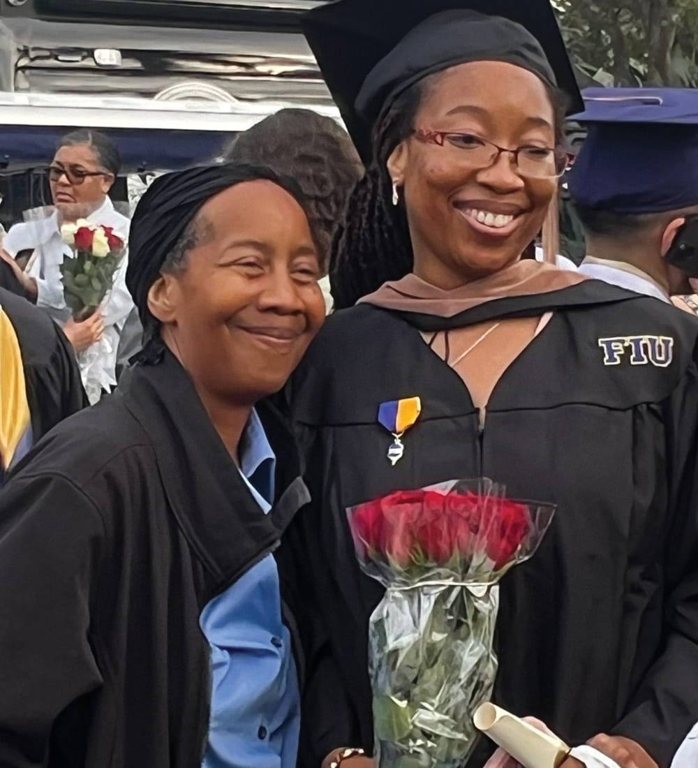 An FIU Business master's program graduate at a fall commencement ceremony on December 10, 2023.