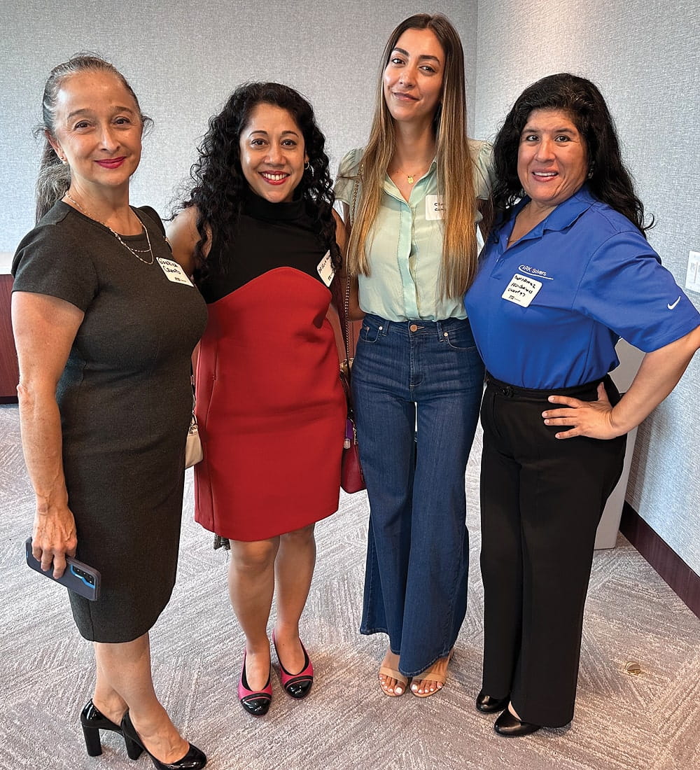 (L to R) Gabriela Crespo, a reception guest; Suchimita Mishra, associate dean, faculty affairs, FIU Business; a reception guest; and Betty Alvarez (BBA '97), client management specialist, Ark Solvers Cybersecurity, at the networking reception cohosted by FIU Business and FIU Law on August 30, 2023.