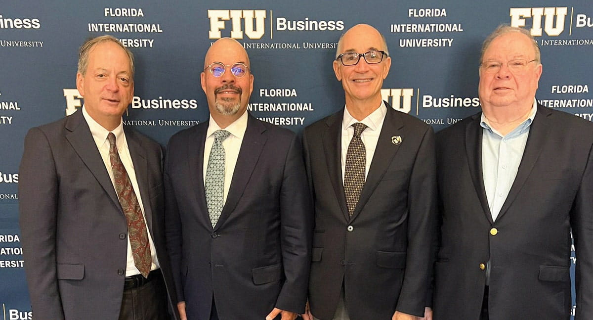 William Hardin, dean, FIU Business; Ivan Garces, chair, FIBA executive committee; Kenneth A. Jessell, then-president, Florida International University; and Marcos Kerbel, assistant teaching professor, finance, FIU Business at the Financial & International Banking Association luncheon, where they signed an agreement renewing FIBA's commitment to the Dr. Felix H. Reyler Memorial Scholarship for $75,000 on October 24, 2024.
