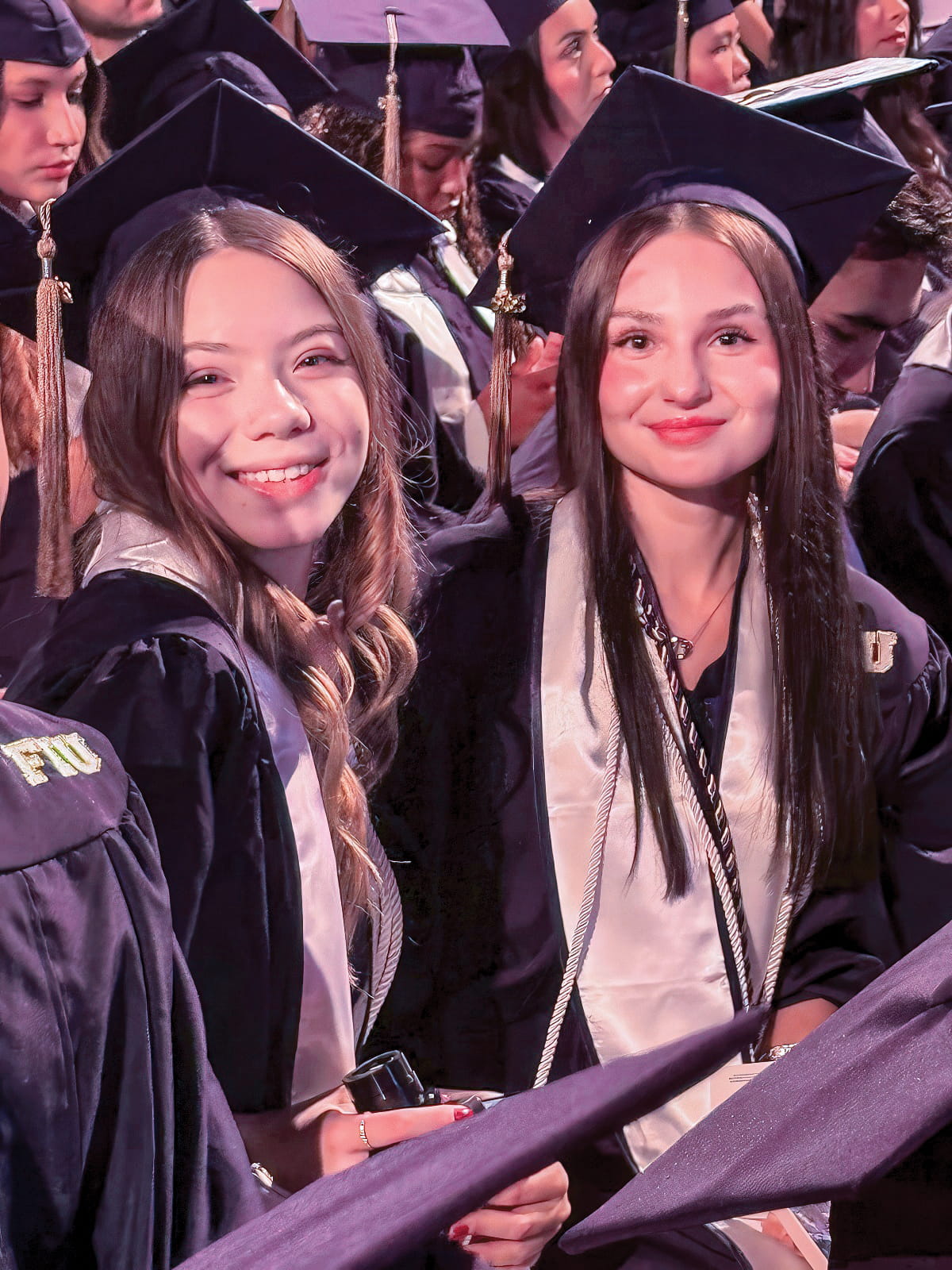 Sofiia Sova and Viktoriia Avdeeva during the fall undergraduate commencement ceremony, held December 18, 2025.