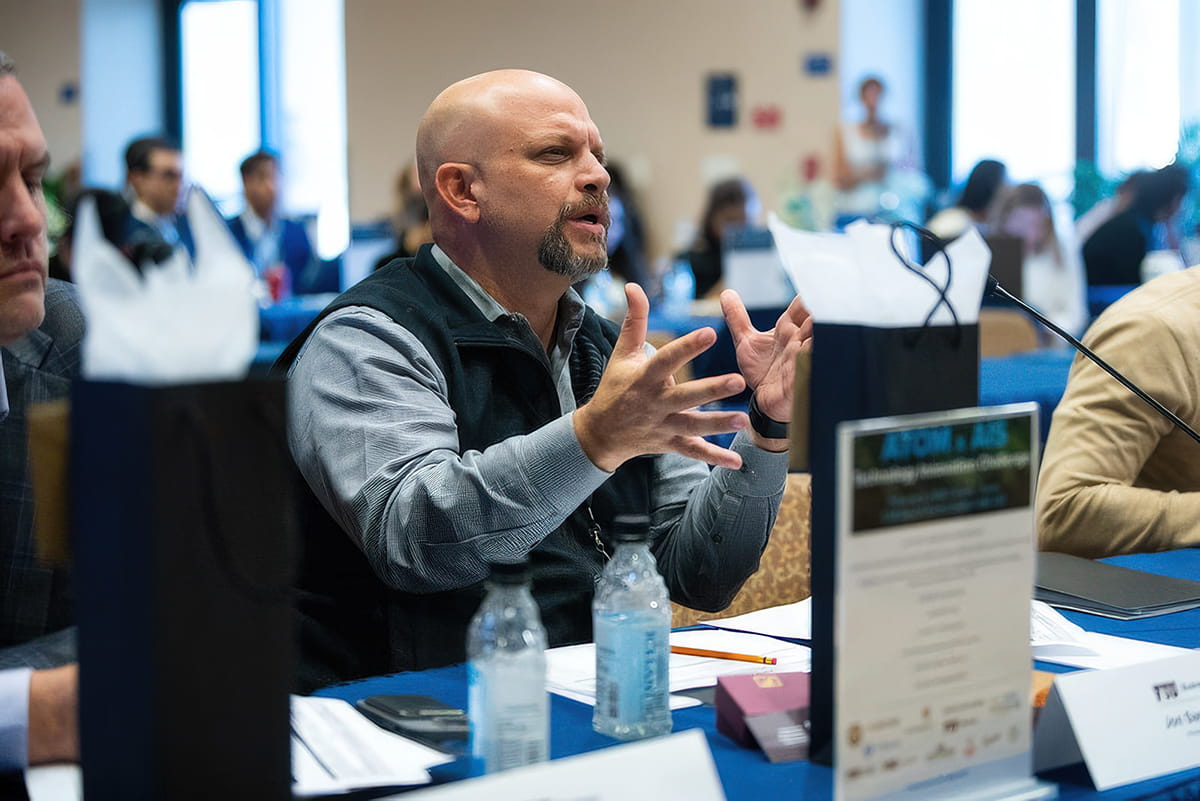 Jon Sastre shared feedback with students at the ATOM x AIS Technology Innovation 2026 Challenge, held February 9, 2026.