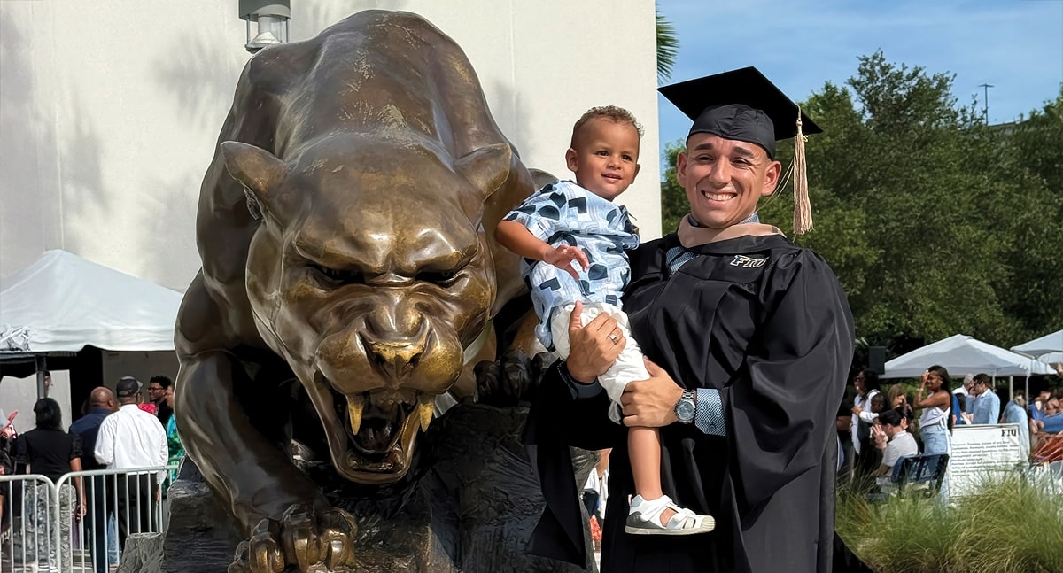 Edgardo Janer and his son at the summer commencement ceremony, held August 6, 2025.
