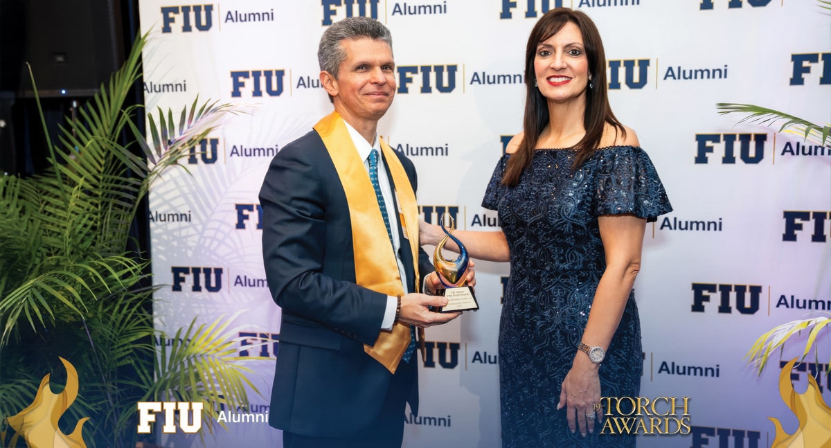 Juan Martinez (MAcc '93, BBA '90), vice president, CFO and treasurer, John S. and James L. Knight Foundation, and FIU Torch Award winner; and Jeanette M. Nunez, president, FIU, at the awards ceremony, held May 17, 2025.