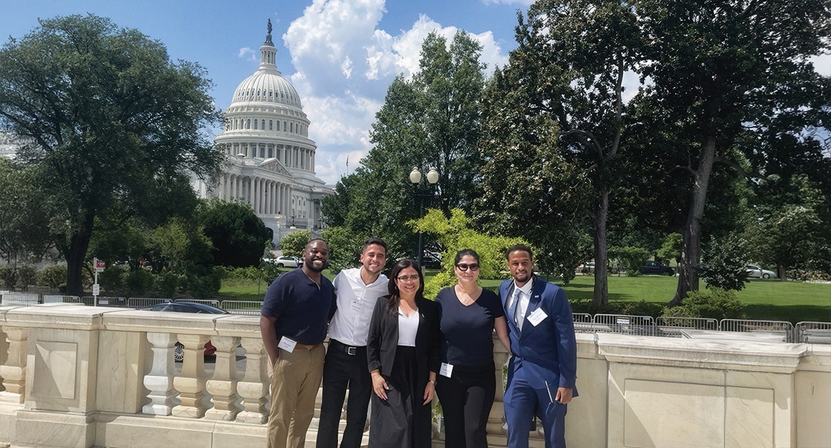 Students Darnel Joseph, German Alvarenga, Patricia Mendoza, Vanessa Rodriguez and Matthew Brown during the MBA in Cybersecurity Risk Management program residency in Washington, D.C., in June of 2025.