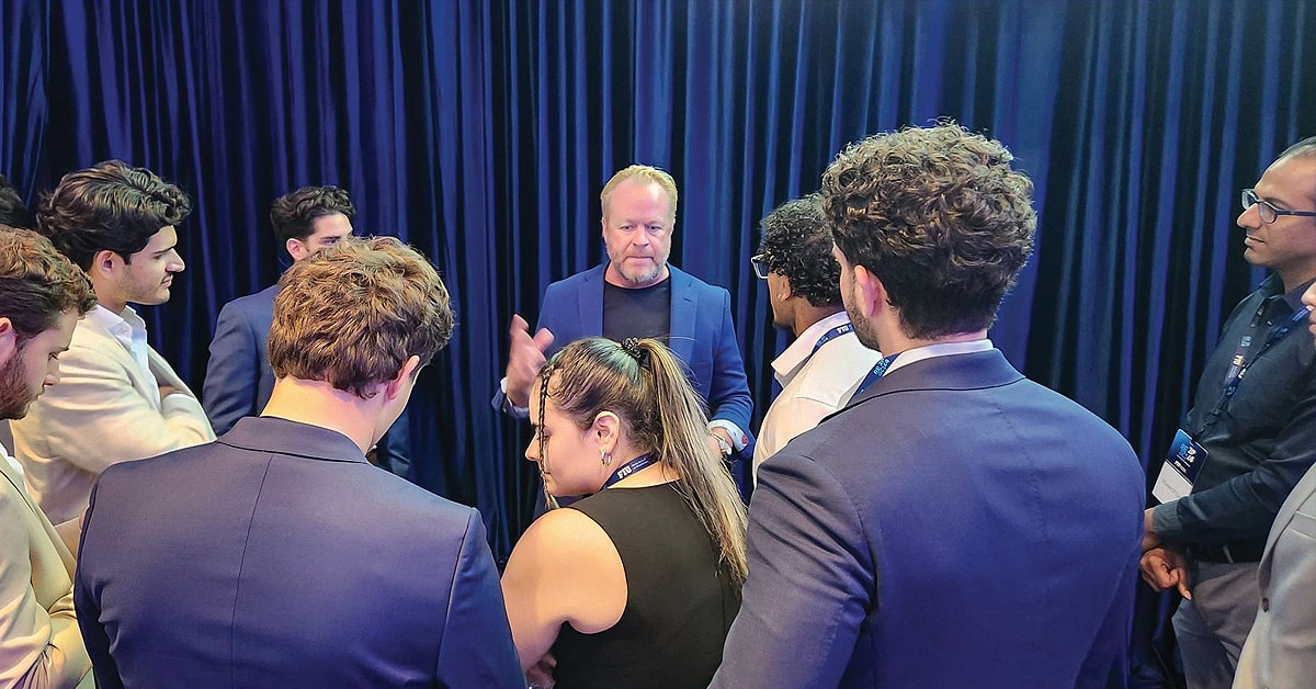 Chad Moss speaking with FIU Business students.