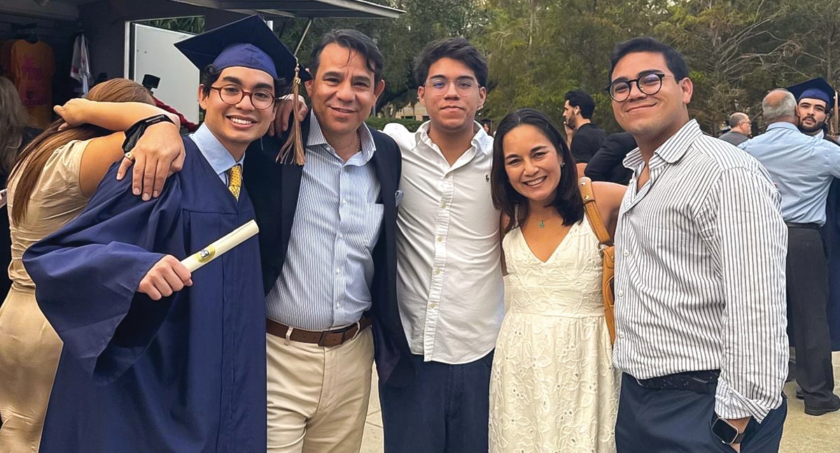 Aleck Estrada with his family at the undergraduate fall commencement ceremony on December 16, 2024.
