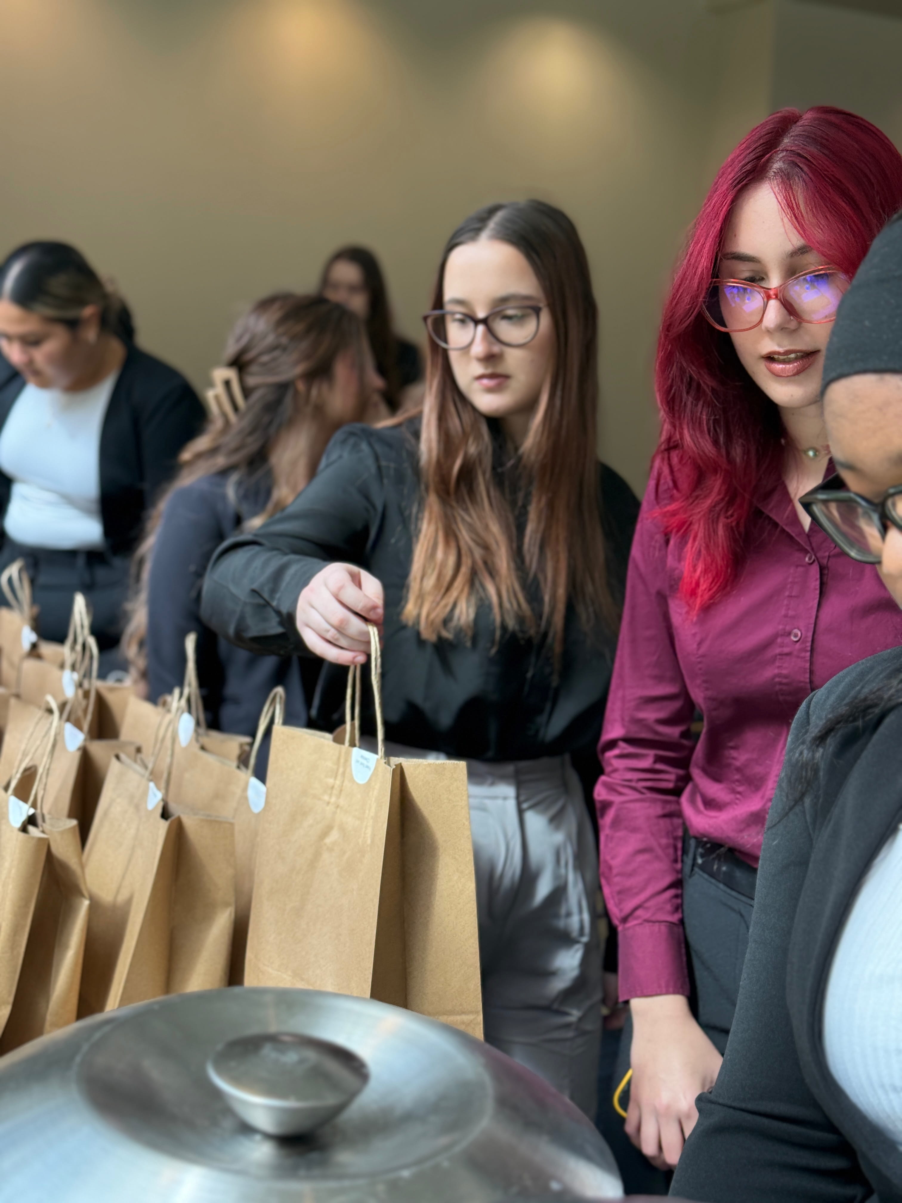 Students grabbing a bite during the Lunch-And-Learn event.