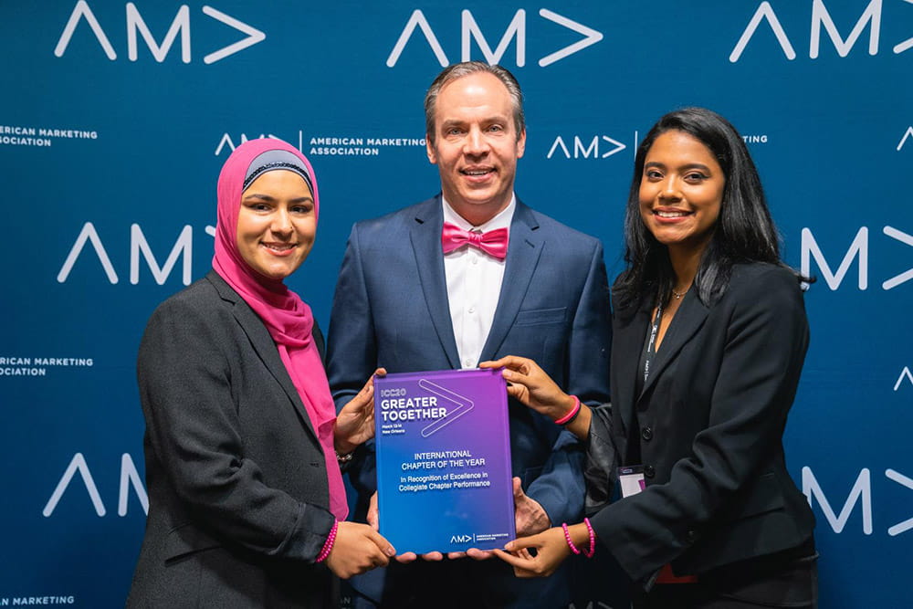 AMA FIU Co-President Naimeh Harami, Professor Tim Birrittella, and Co-President Karla Rosario.