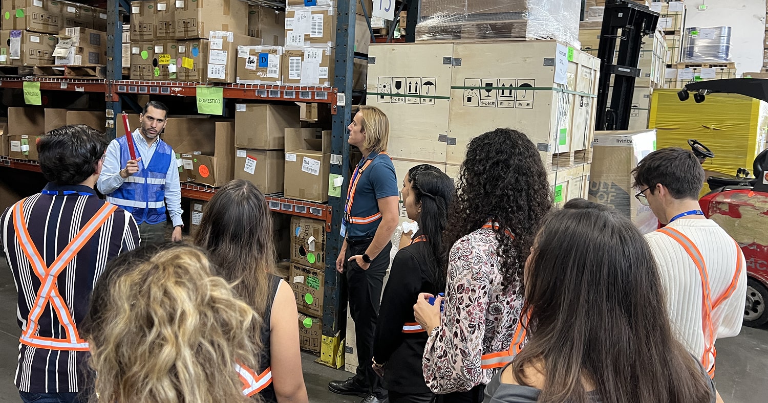 Students take a tour of the warehouse facility at Interport.